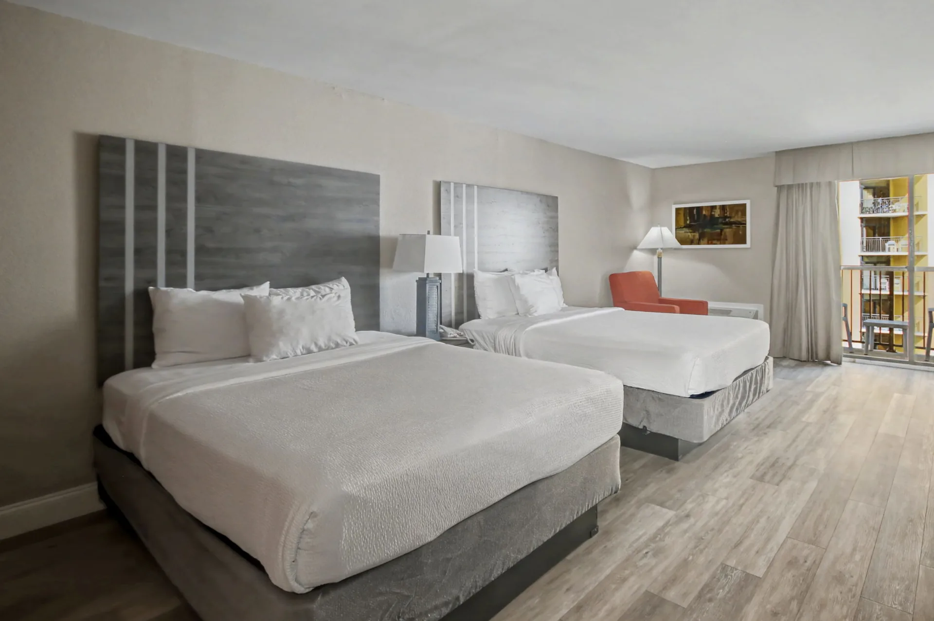 This Resort View Standard Room features two queen-size beds, a small refrigerator, a microwave, a full bathroom, a TV, and a private balcony. An ocean view is not guaranteed.