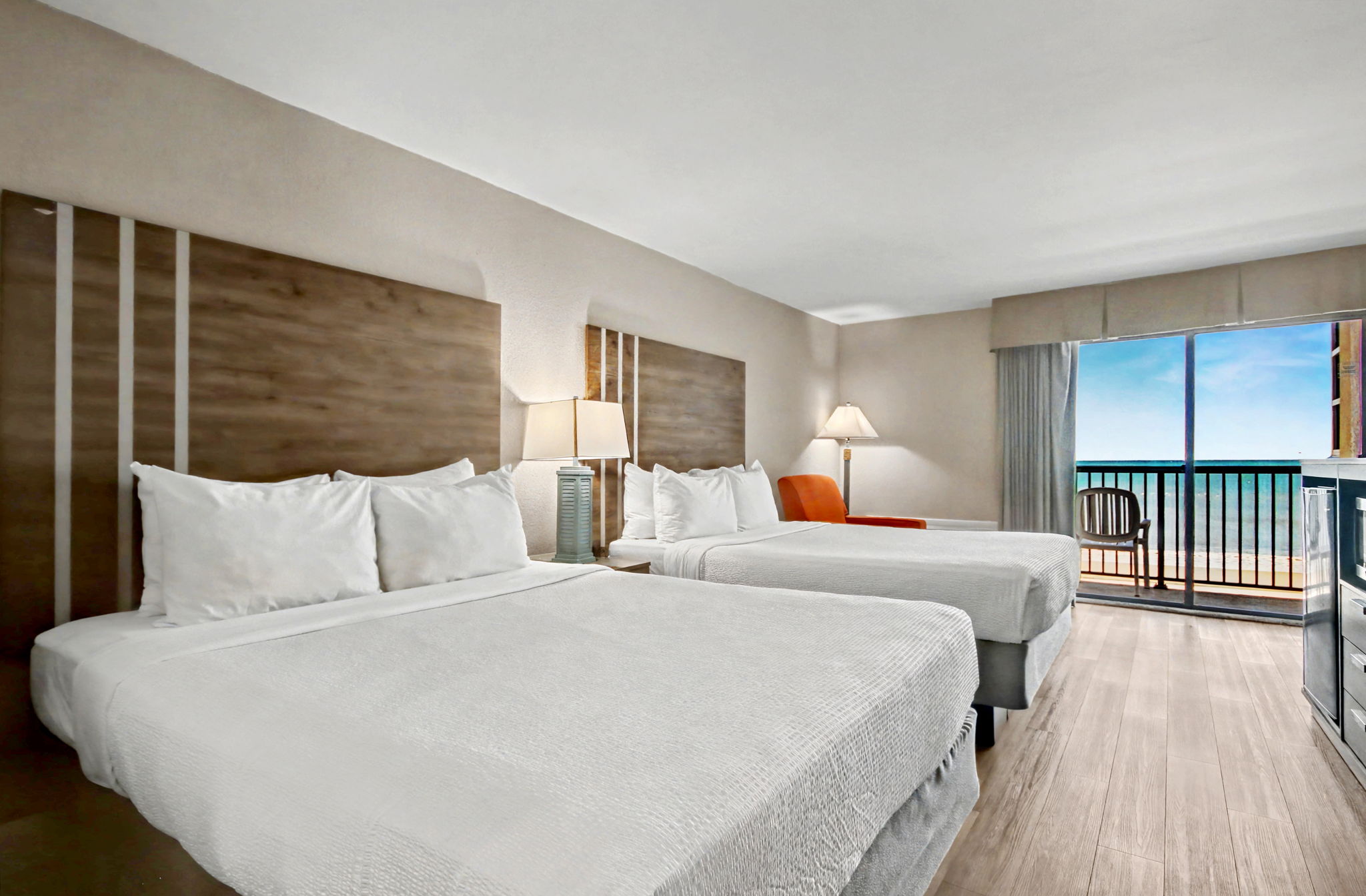Recently renovated, this room includes 2 queen beds, 1 bathroom, a small refrigerator, microwave, and balcony with an ocean view.